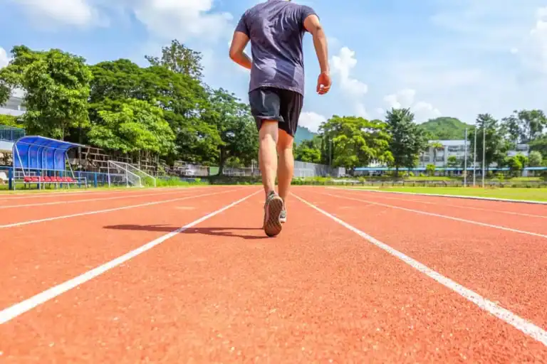 Person walking on outdoor running track